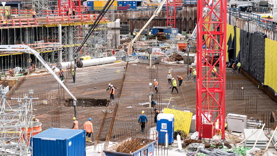 A bustling construction site in Hamburg with workers and equipment actively engaged in building tasks
